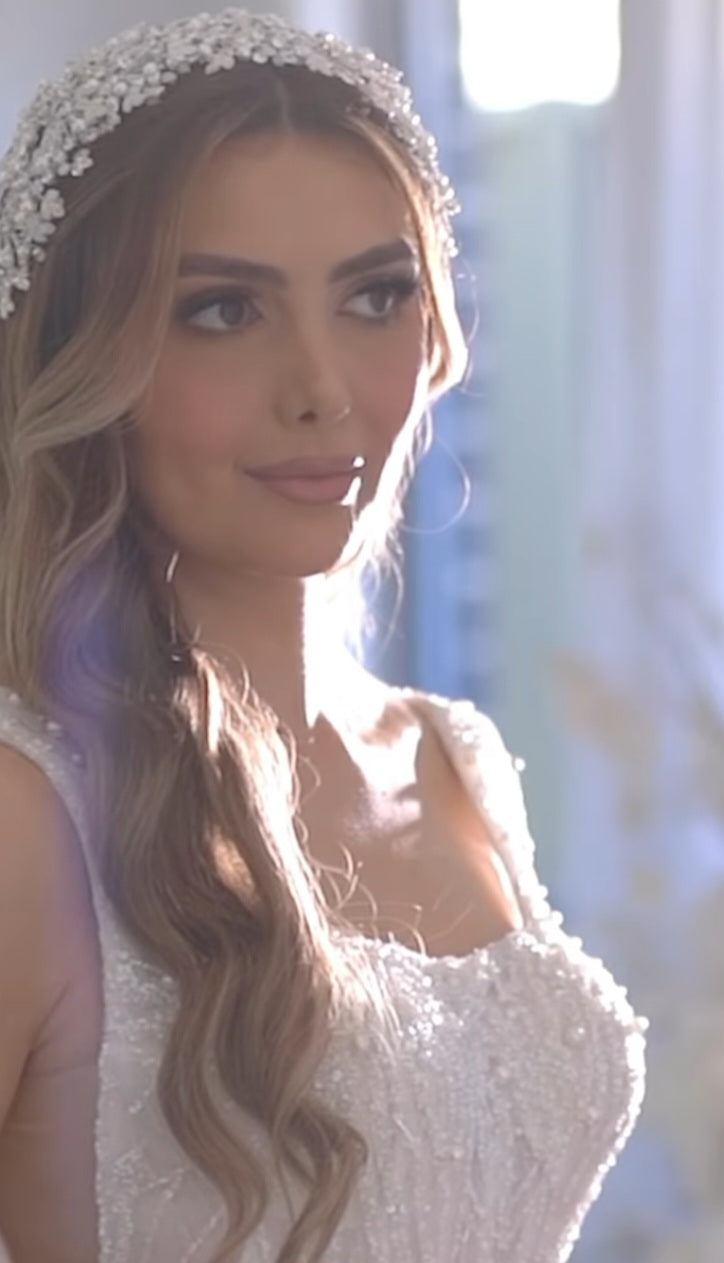 Bride wearing pearl bridal headpiece