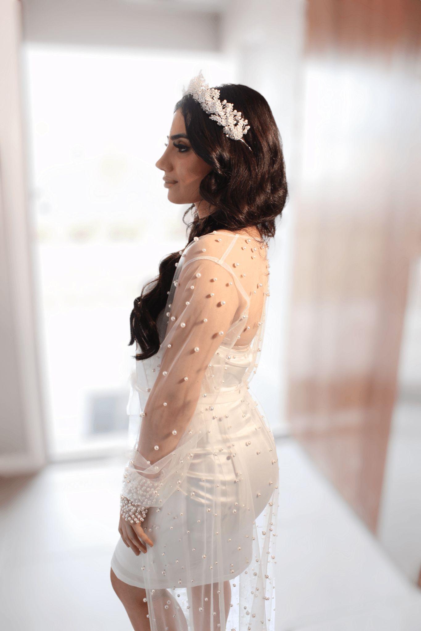 bride wearing pearl Bridal Robe side angle pose