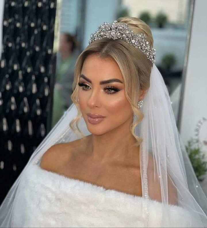 Bride wearing pearl bridal veil