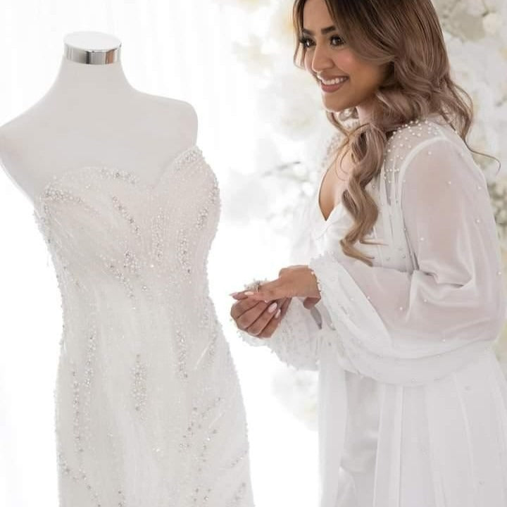 Bride wearing pearl bridal robe and bridal slip
