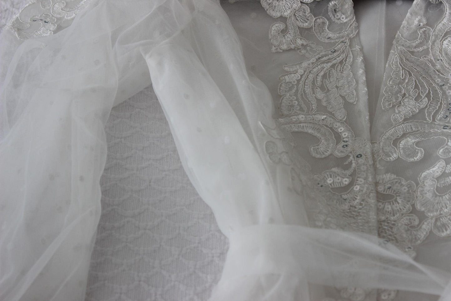 Ariana Lace Robe laid out on a bed