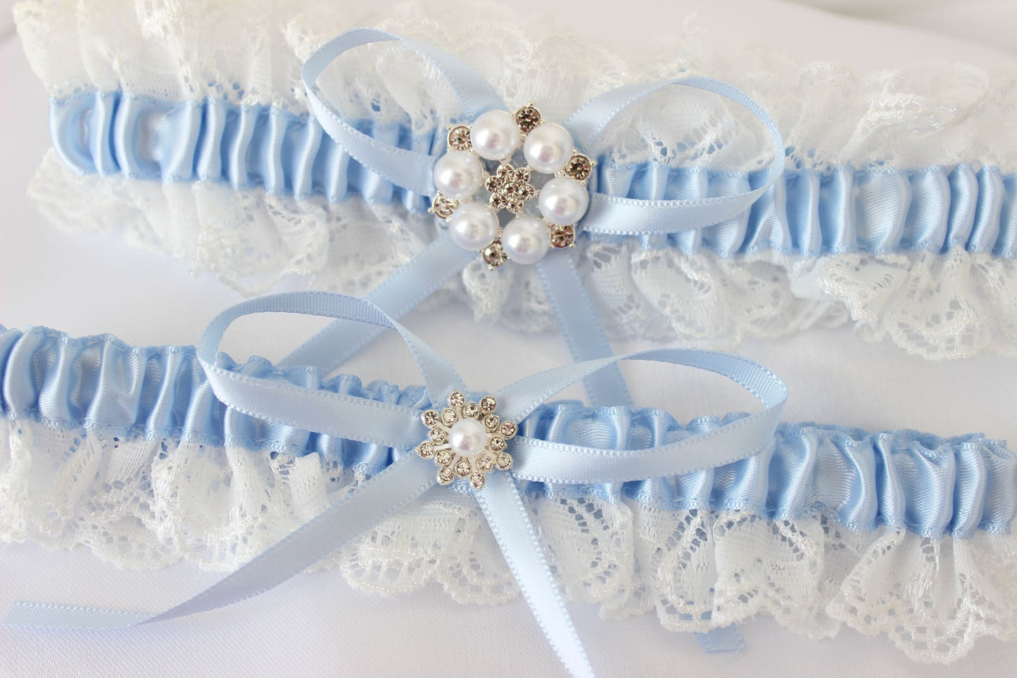 Baby white and blue lace wedding garter set