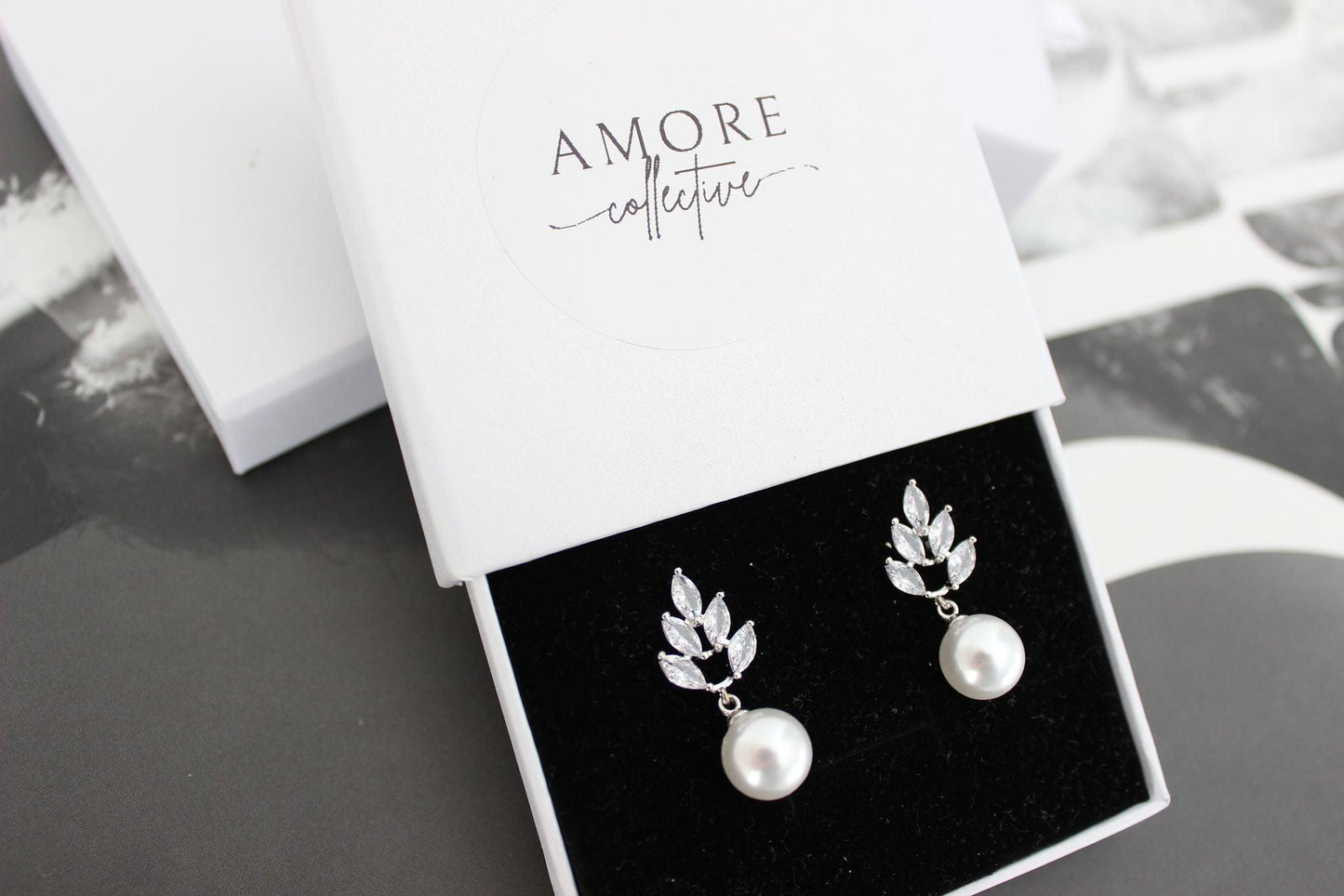 jessica silver earrings with leaf detail at top and luminous pearl drop