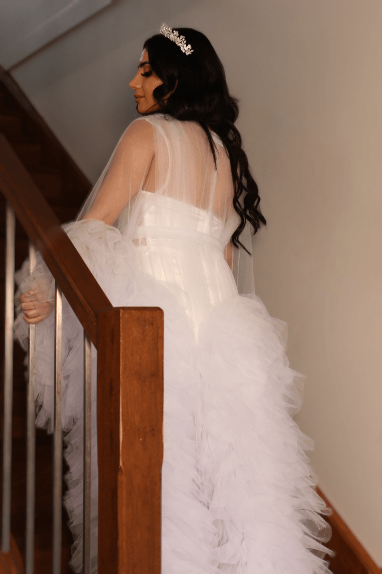 bride walking on stairs wearing Fluffy butterfly robe