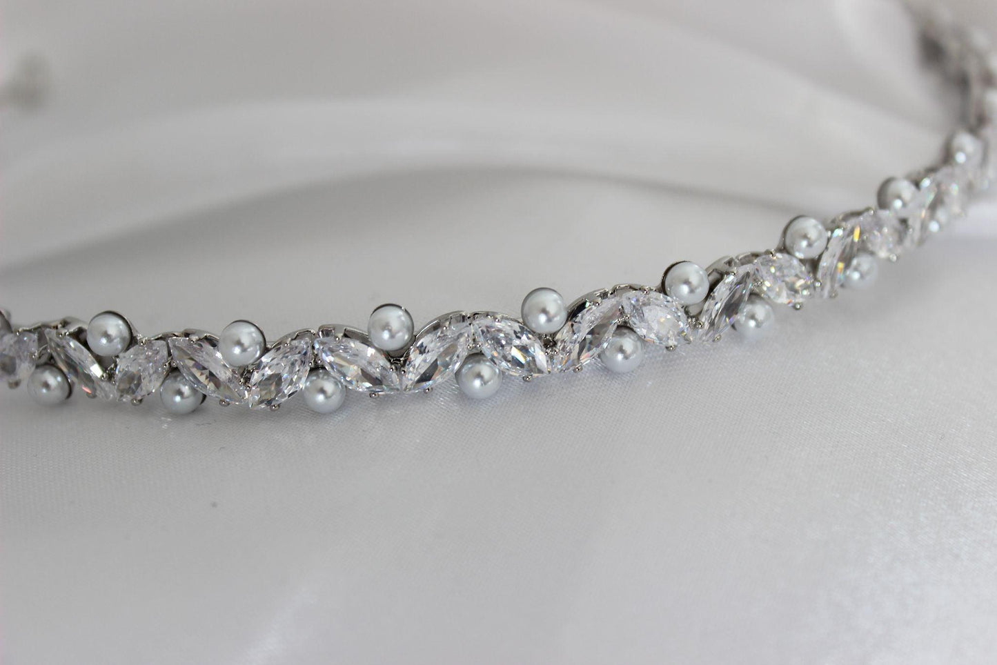Jordyn crystal and pearl silver bridal headband on white cloth