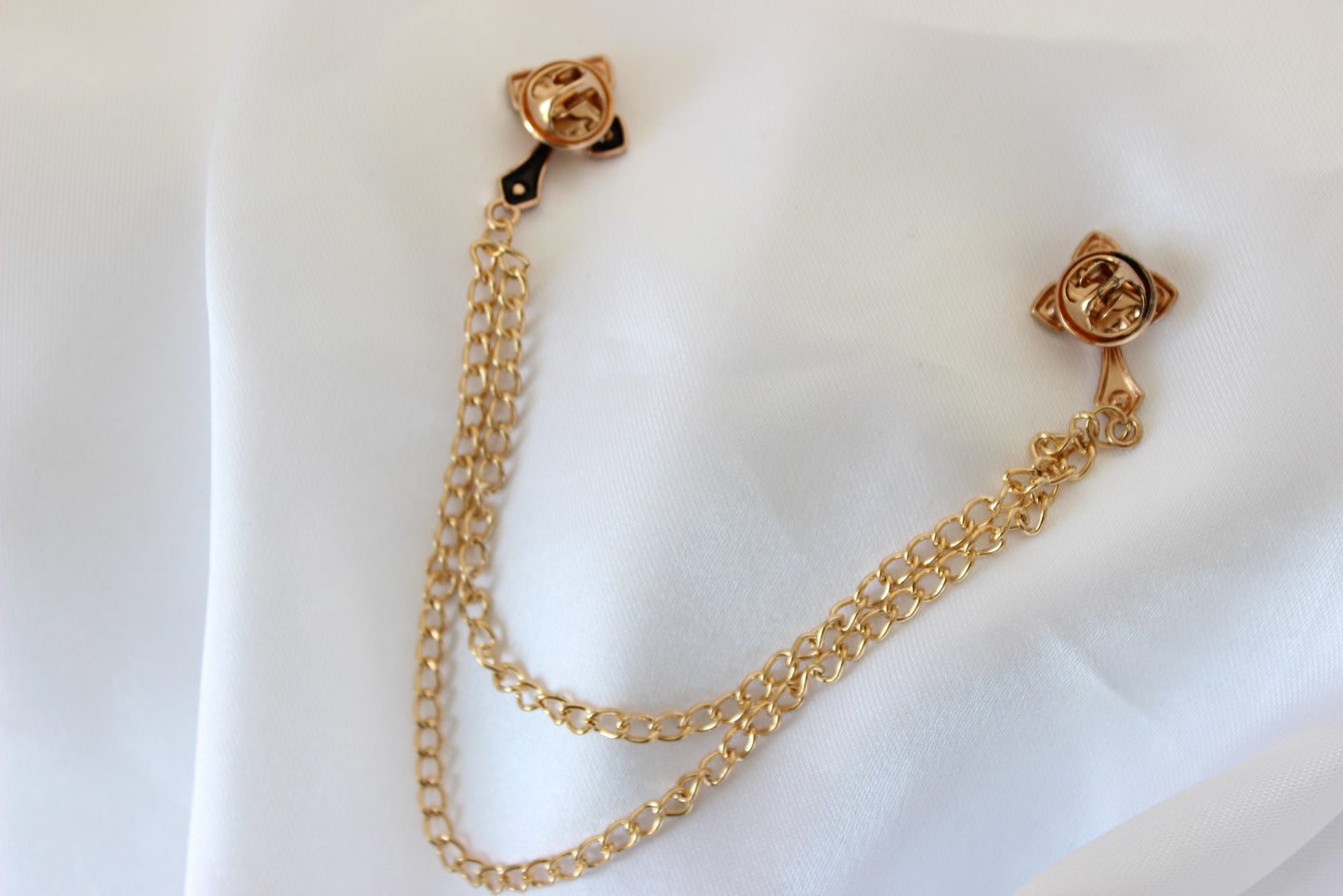 Rose gold cross chain pin