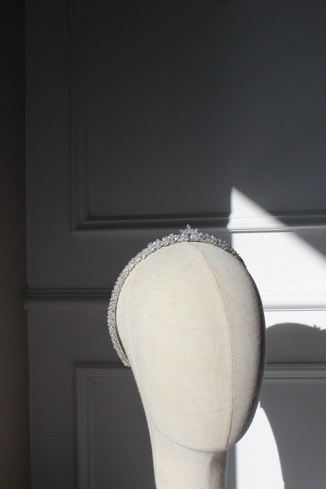 Vivian slim silver bridal tiara on mannequin