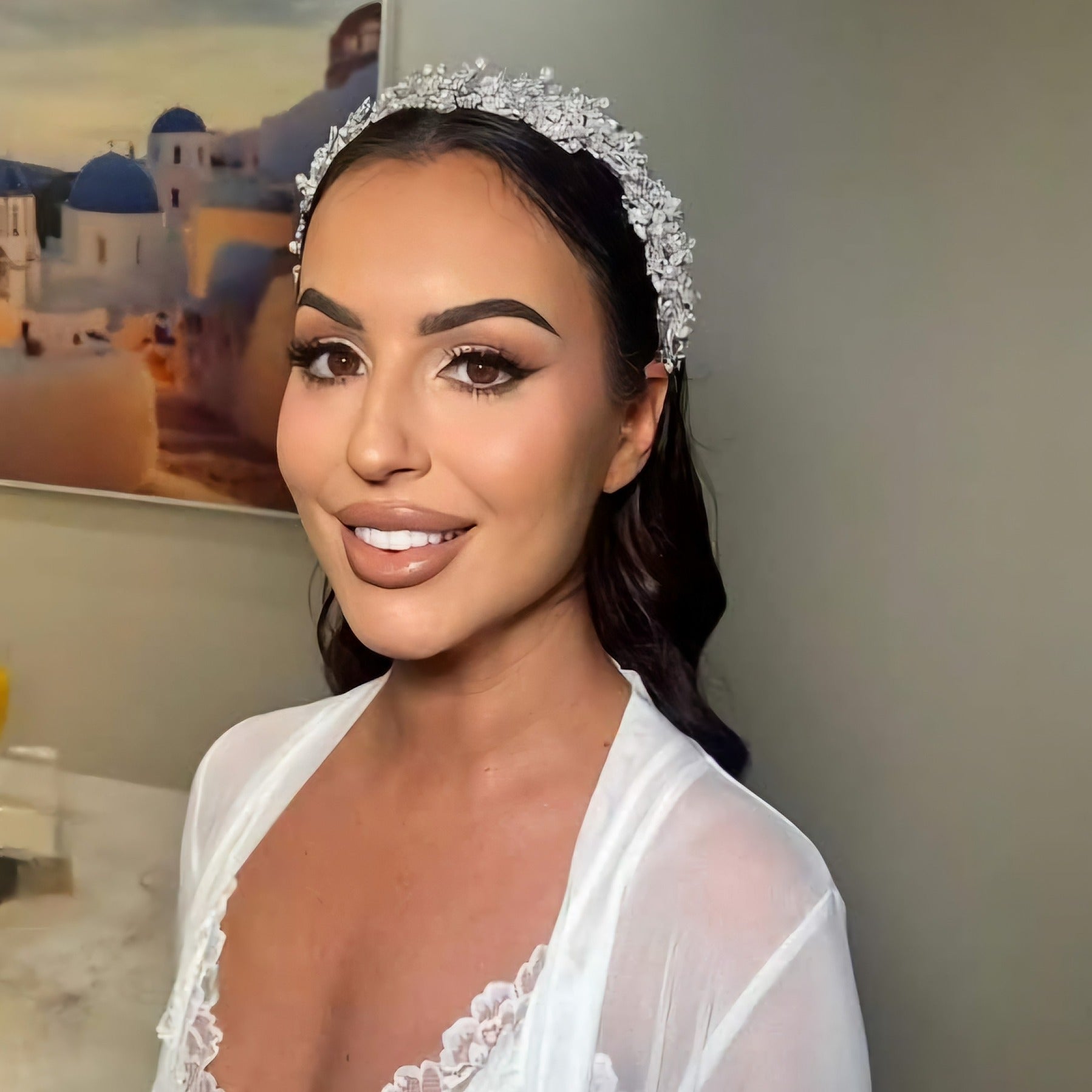 Bride wearing silver bridal headpiece with pearls