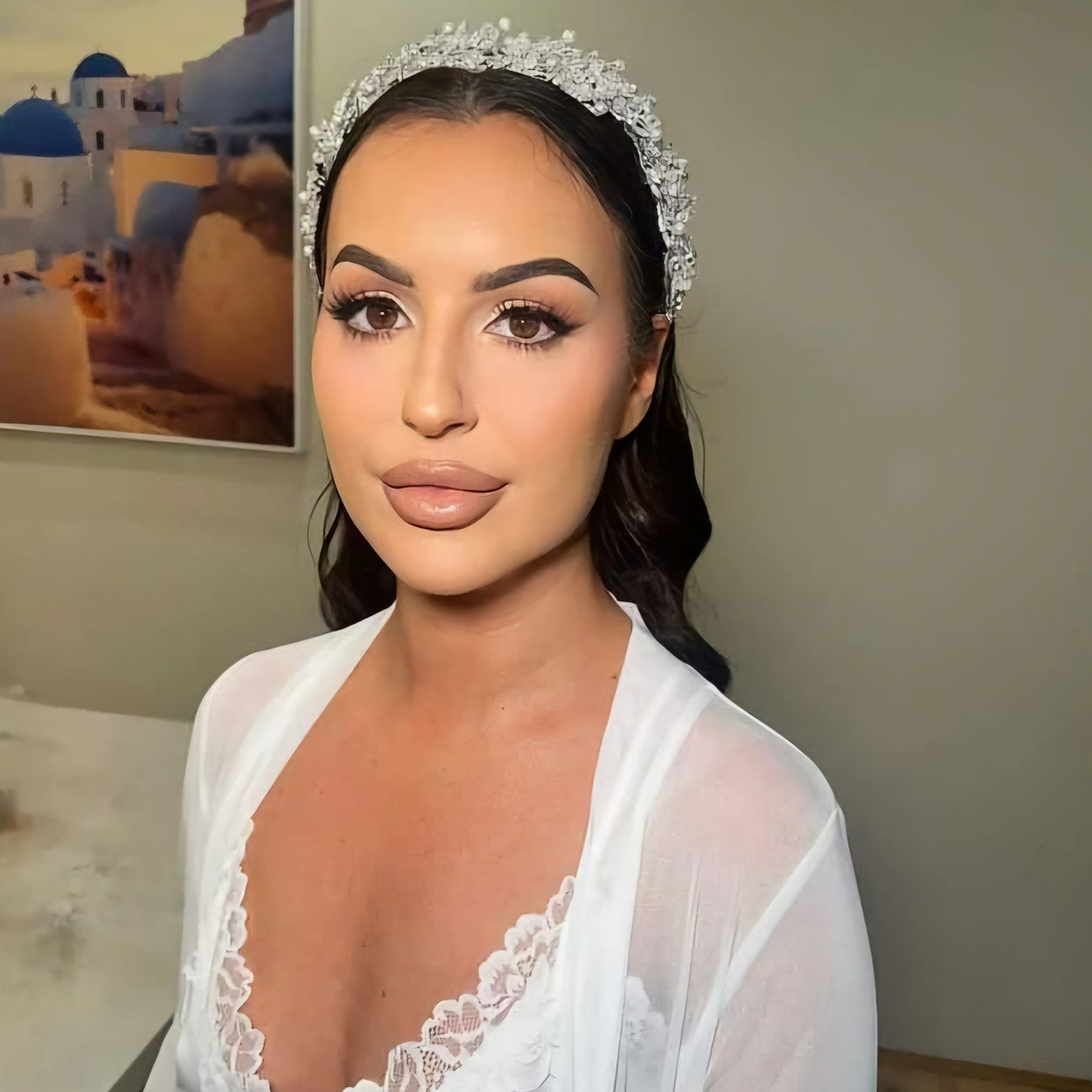 Bride wearing silver bridal headpiece with pearls