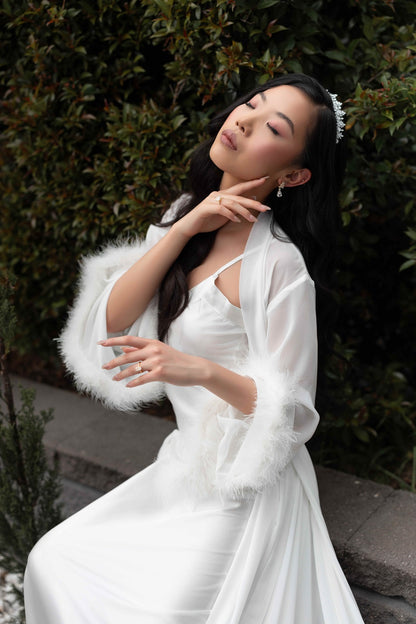 Model wearing fluffy bridal robe and silver bridal tiara