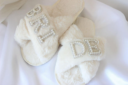 Bridal slippers with "bride" text on white cloth