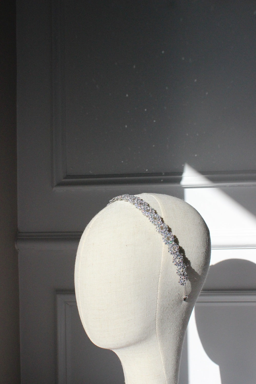 Silver bridal headband on mannequin