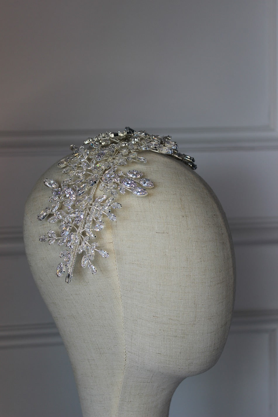 Grace Couture silver bridal headpiece with crystal leaf design displayed on a mannequin head