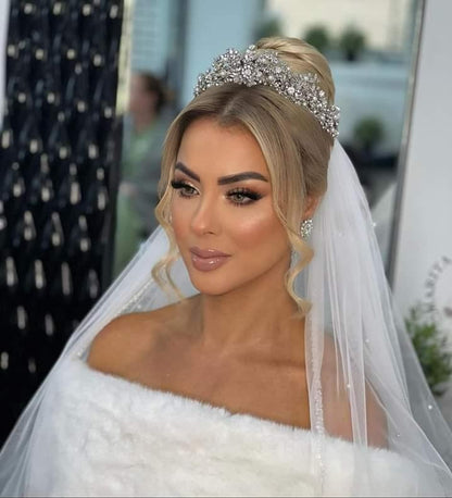 Bride wearing pearl bridal veil