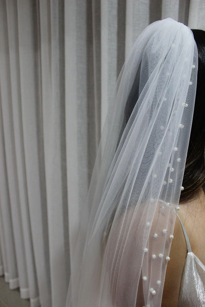 Bride Wearing Pearl Mantilla Veil
