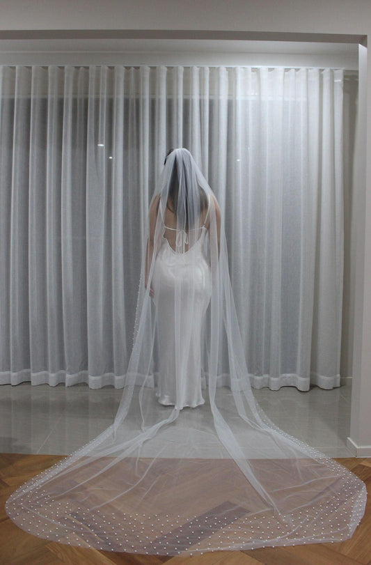 Bride Wearing Pearl Mantilla Veil