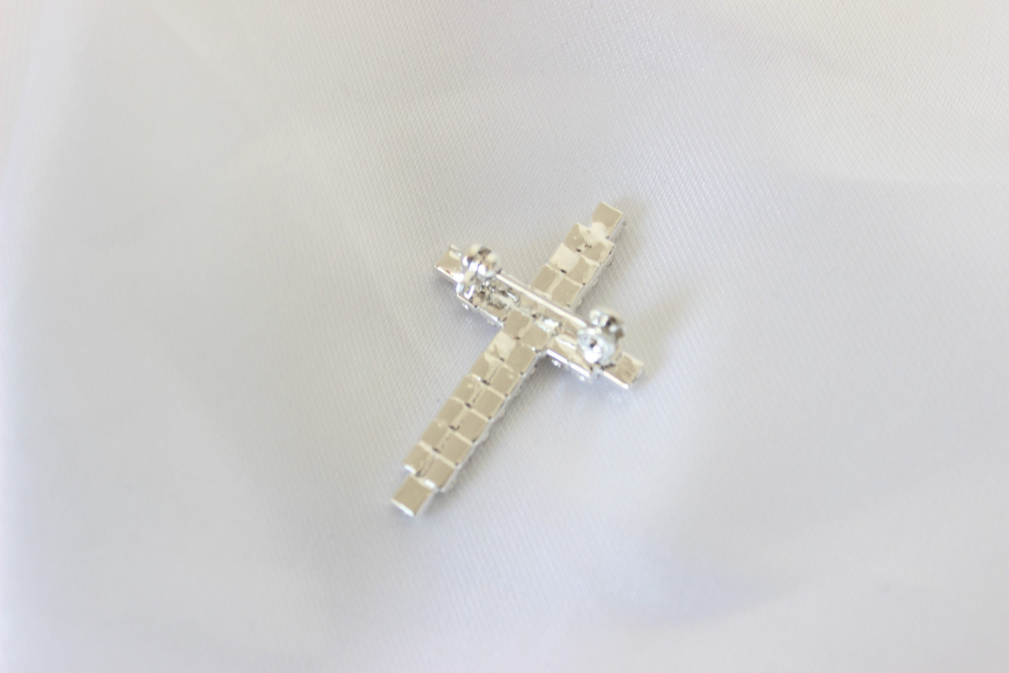 Peter Silver Cross Pin on white cloth