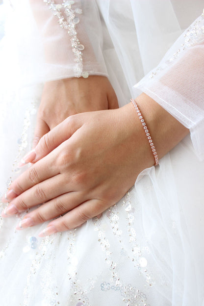 rose gold tennis bracelet on bride
