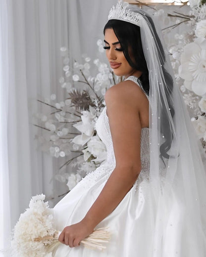 Bride wearing pearl veil and bridal crown