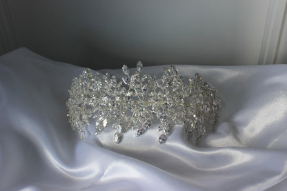 Grace Couture silver bridal headpiece with crystal leaf design displayed on a cloth mannequin head