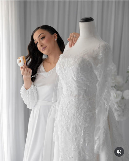 Bride wearing pearl chiffon robe