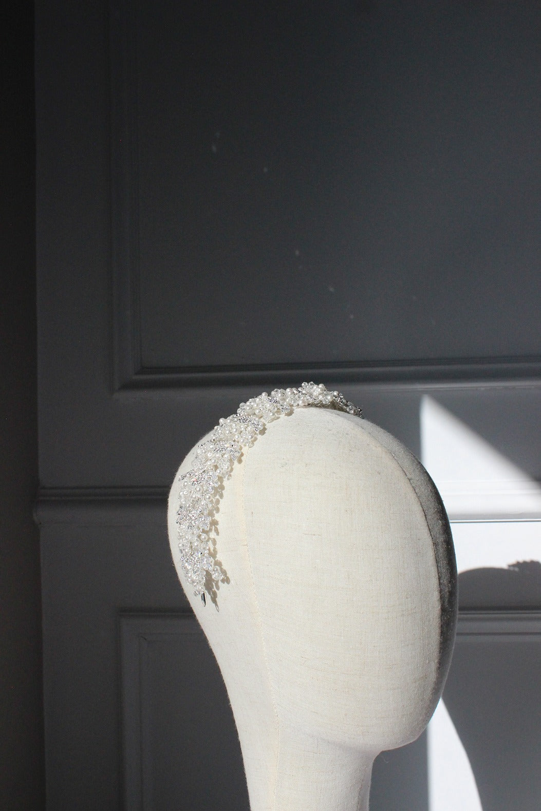 Bridal headpiece with sparkling crystals on mannequin