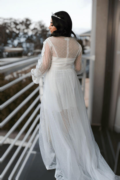 Bride wearing the Ariana Lace Robe  back view showcasing poke dot details.
