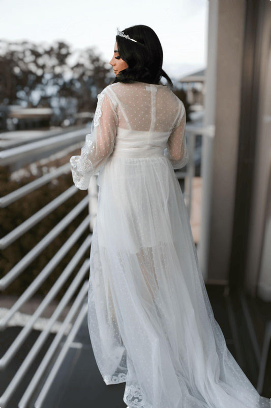 Bride wearing the Ariana Lace Robe  back view showcasing poke dot details.