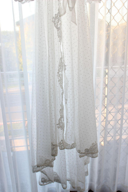 Close up of the bottom hem of the Ariana Lace Robe