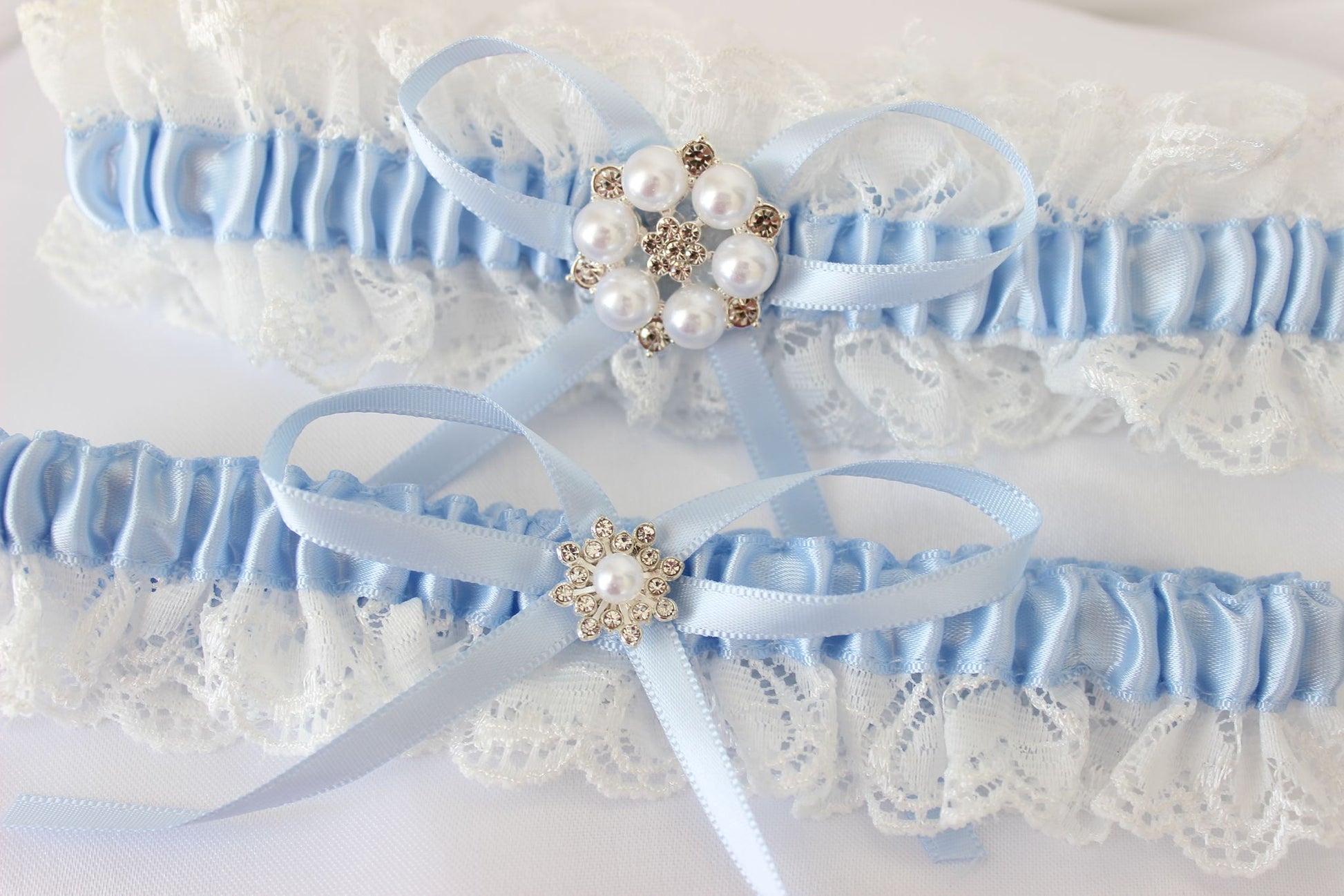 Baby white and blue lace wedding garter set