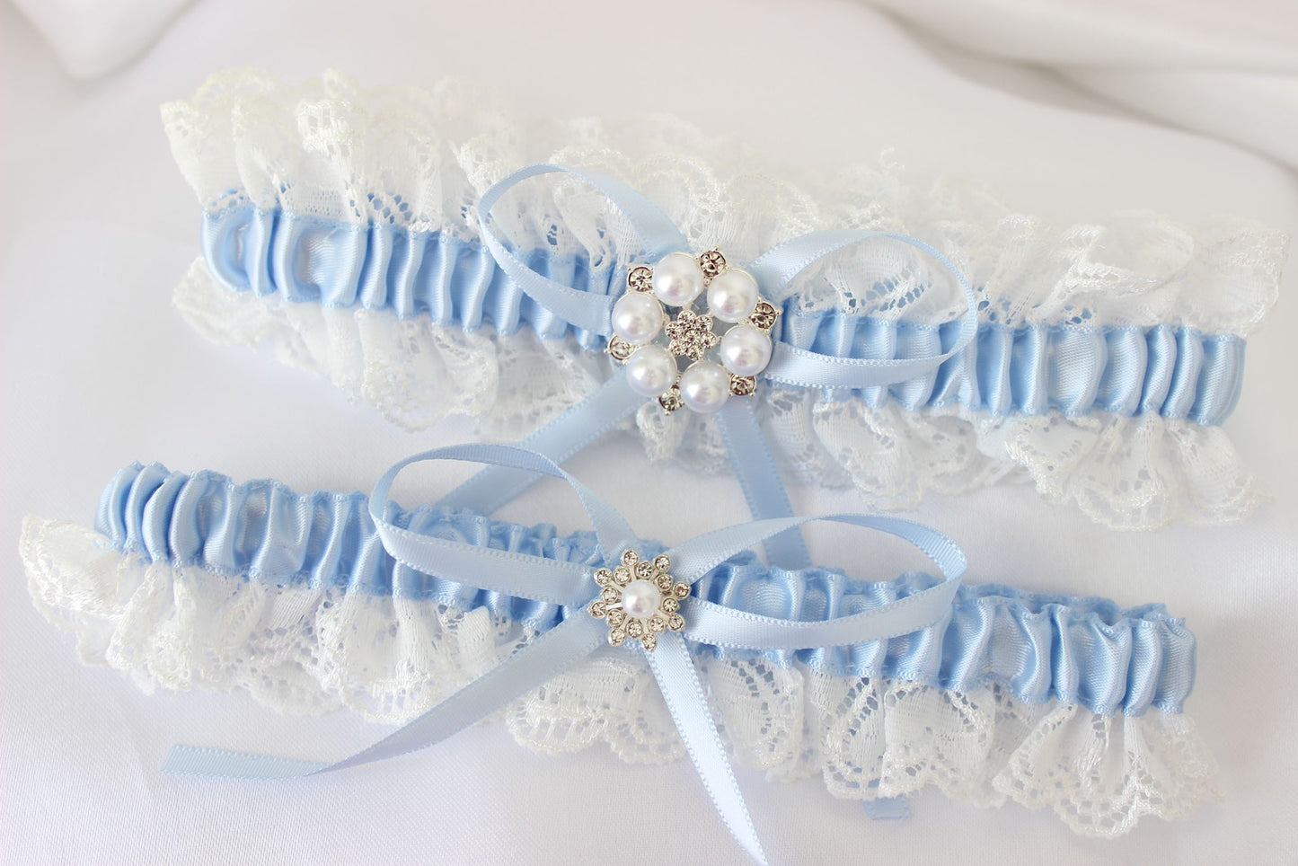 Baby white and blue lace wedding garter set