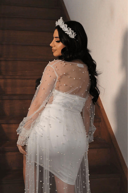 bride wearing pearl Bridal Robe walking upstairs