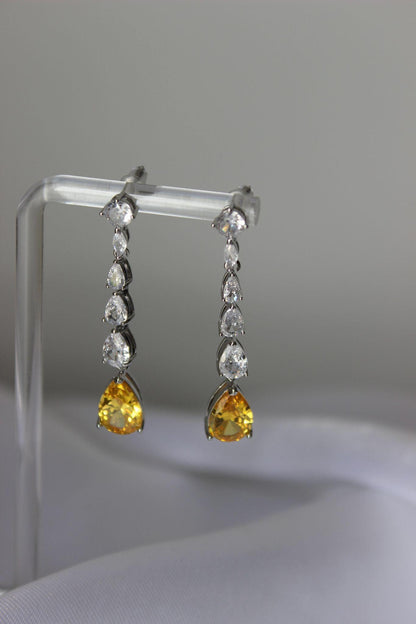 Canary Yellow Drop Earrings on earring stand