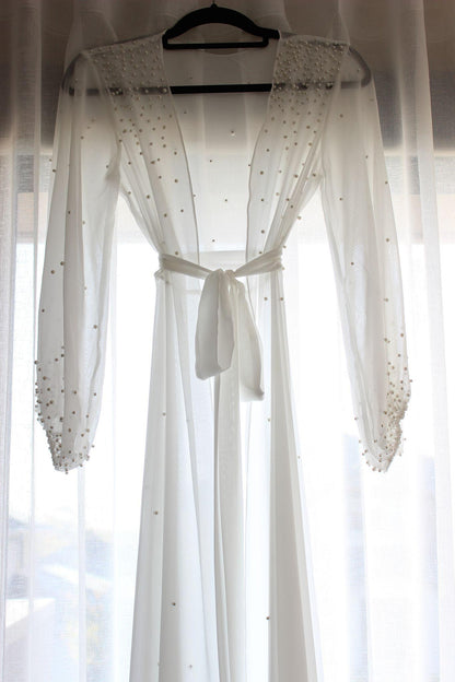 Chiffon Pearl Bridal Robe Hung On Curtain