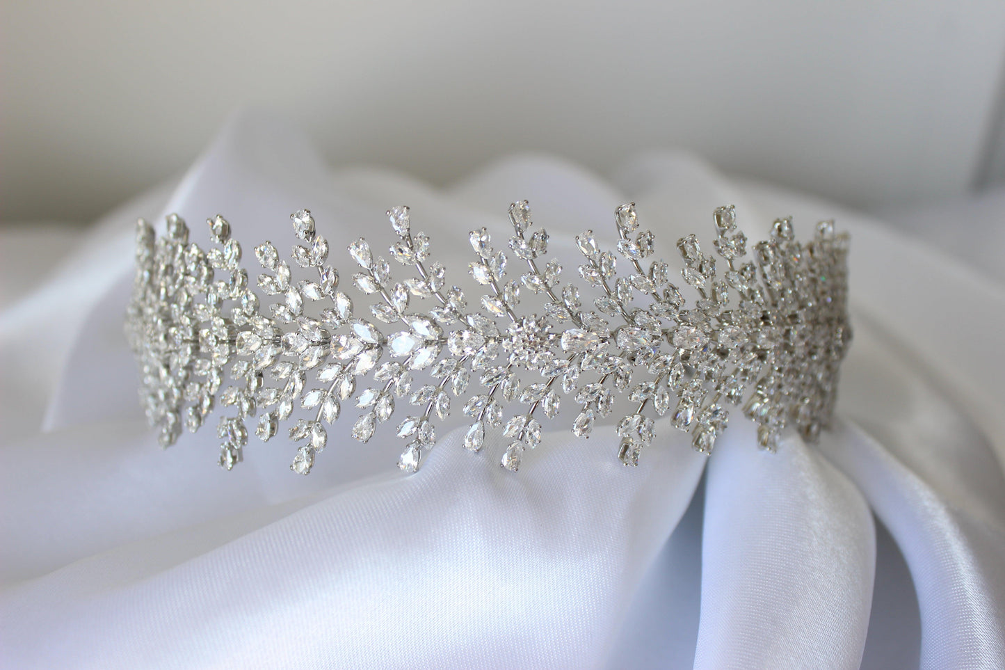 Christina bridal headband resting on soft white cloth