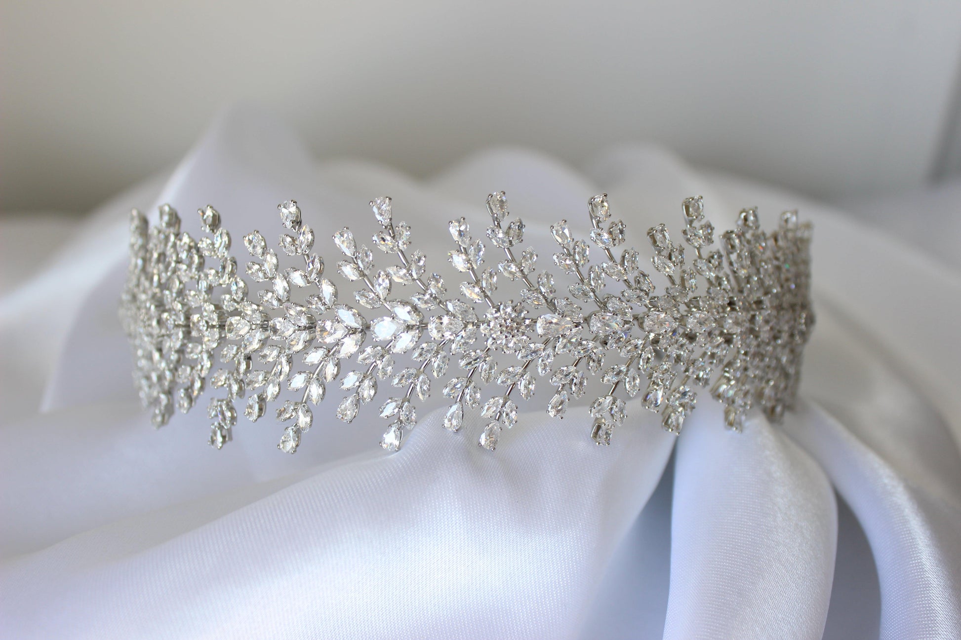 Christina bridal headband resting on soft white cloth