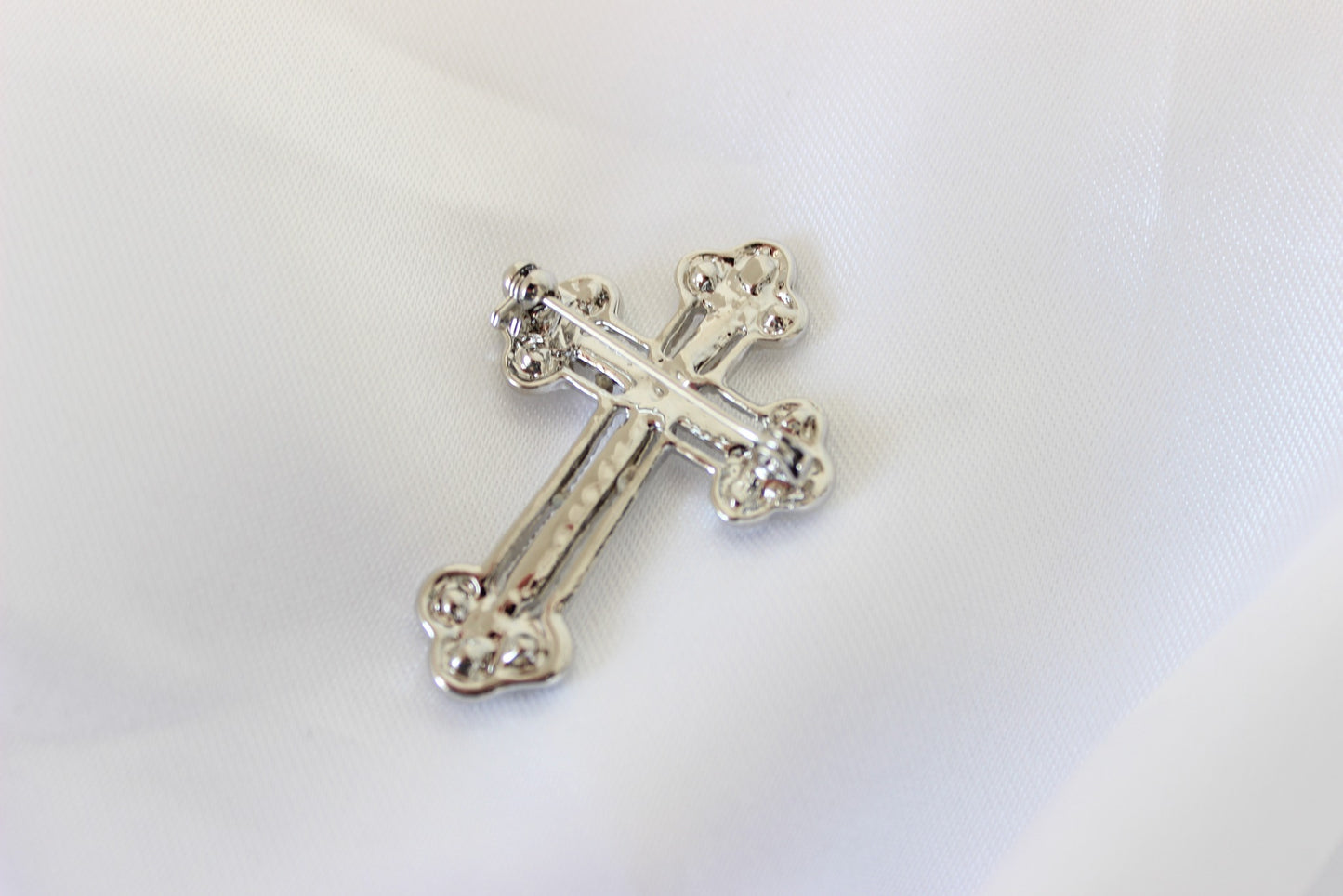 David silver Orthodox cross suit pin on white background