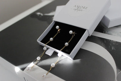 diana pearl gold drop earrings with long pearl drops