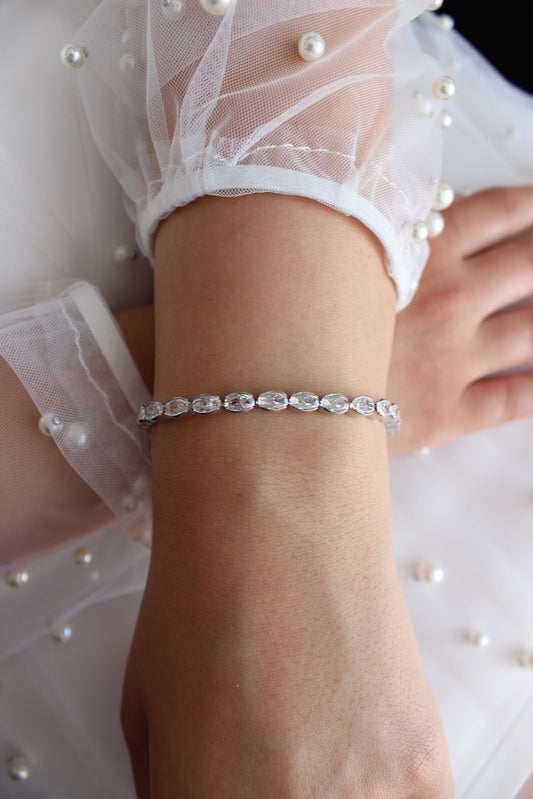 East West Oval Tennis Bracelet displayed on bracelet mannequin stand