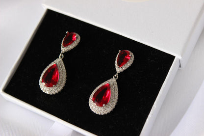 Close-up of Emily Ruby Drop Earrings in jewellery box