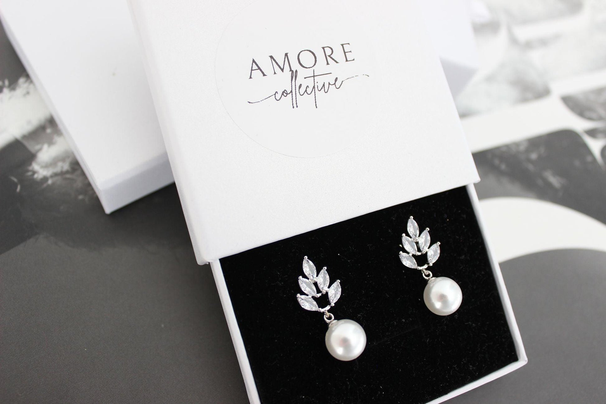 jessica silver earrings with leaf detail at top and luminous pearl drop