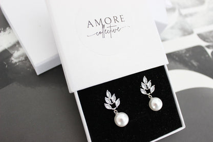 jessica silver earrings with leaf detail at top and luminous pearl drop