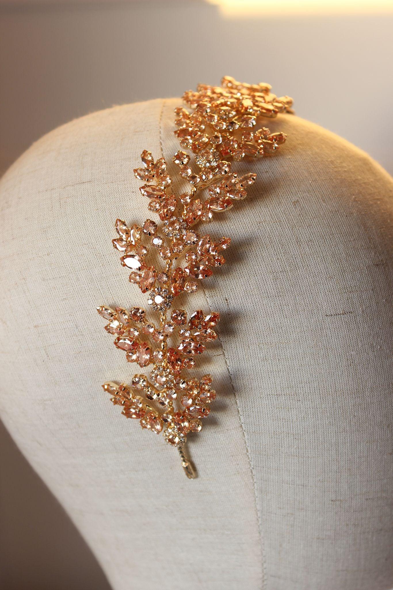 Close up detail of gold flat wedding bridal hair headpiece