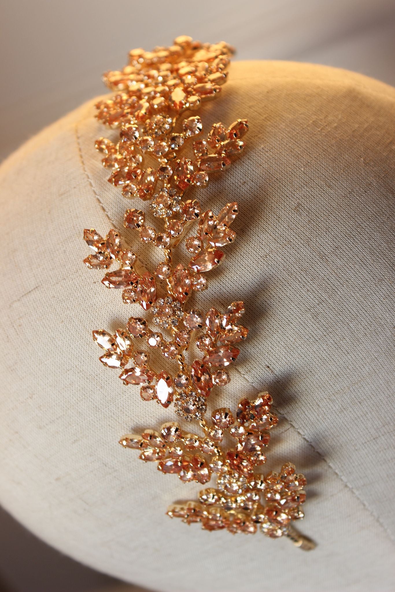 Gold flat bridal hair headpiece displayed on mannequin