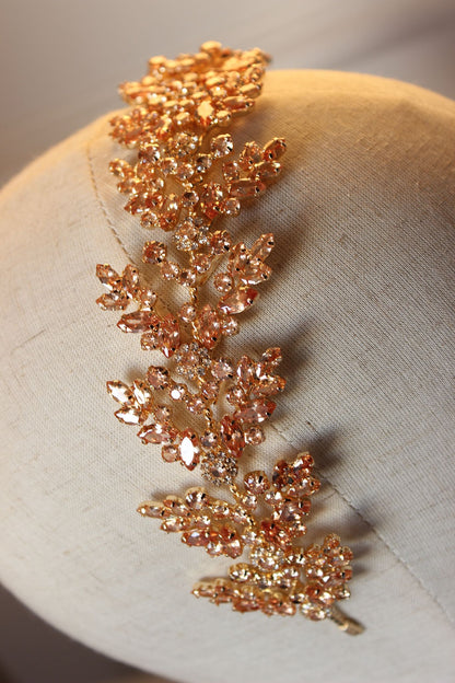 Gold flat bridal hair headpiece displayed on mannequin