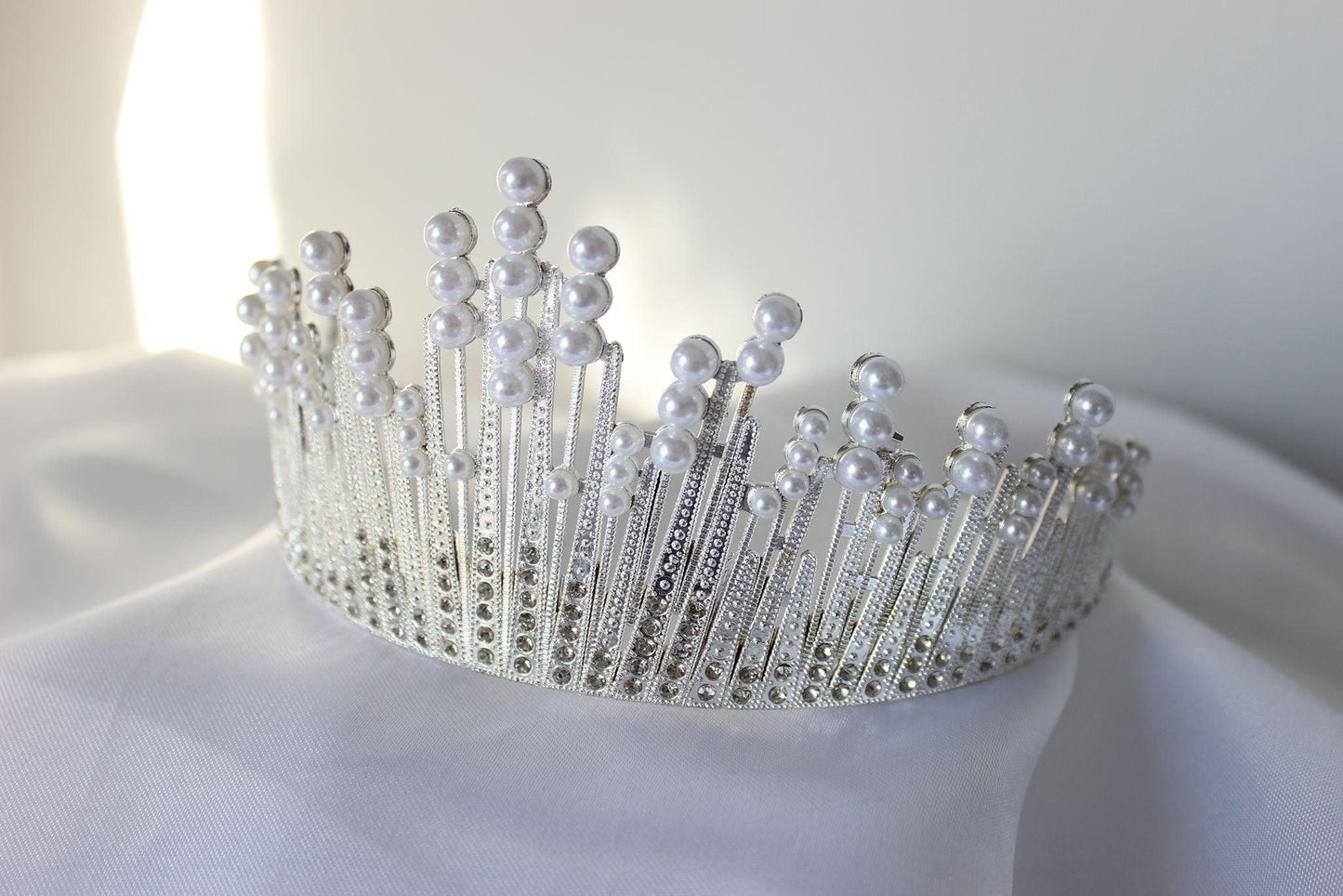 large white and silver wedding crown with pearls