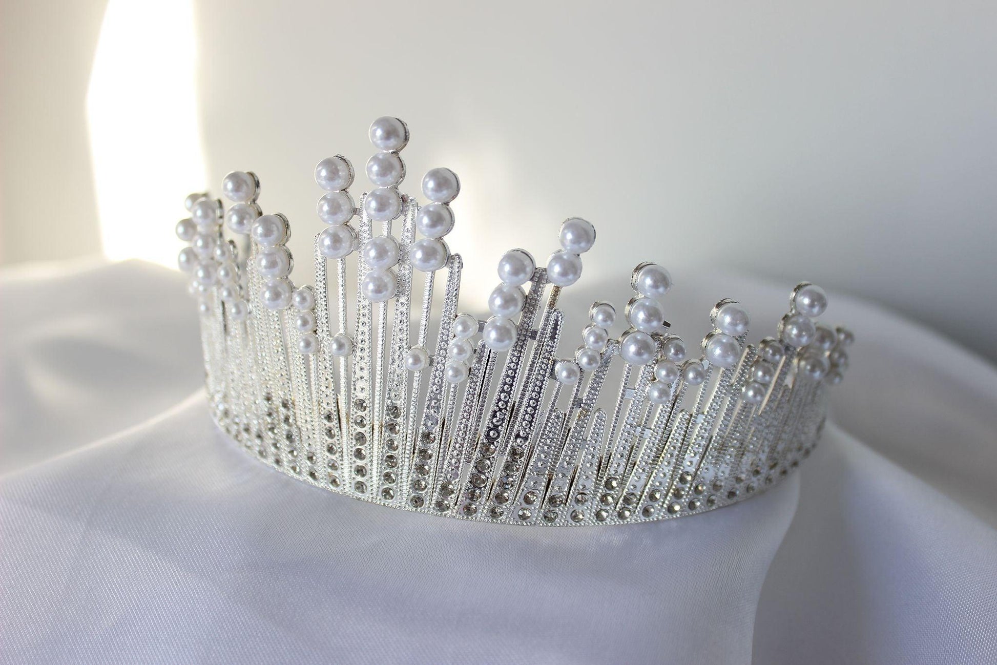 large white and silver wedding crown with pearls