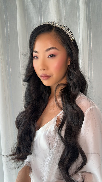 bride wearing lace robe staring into camera deeply