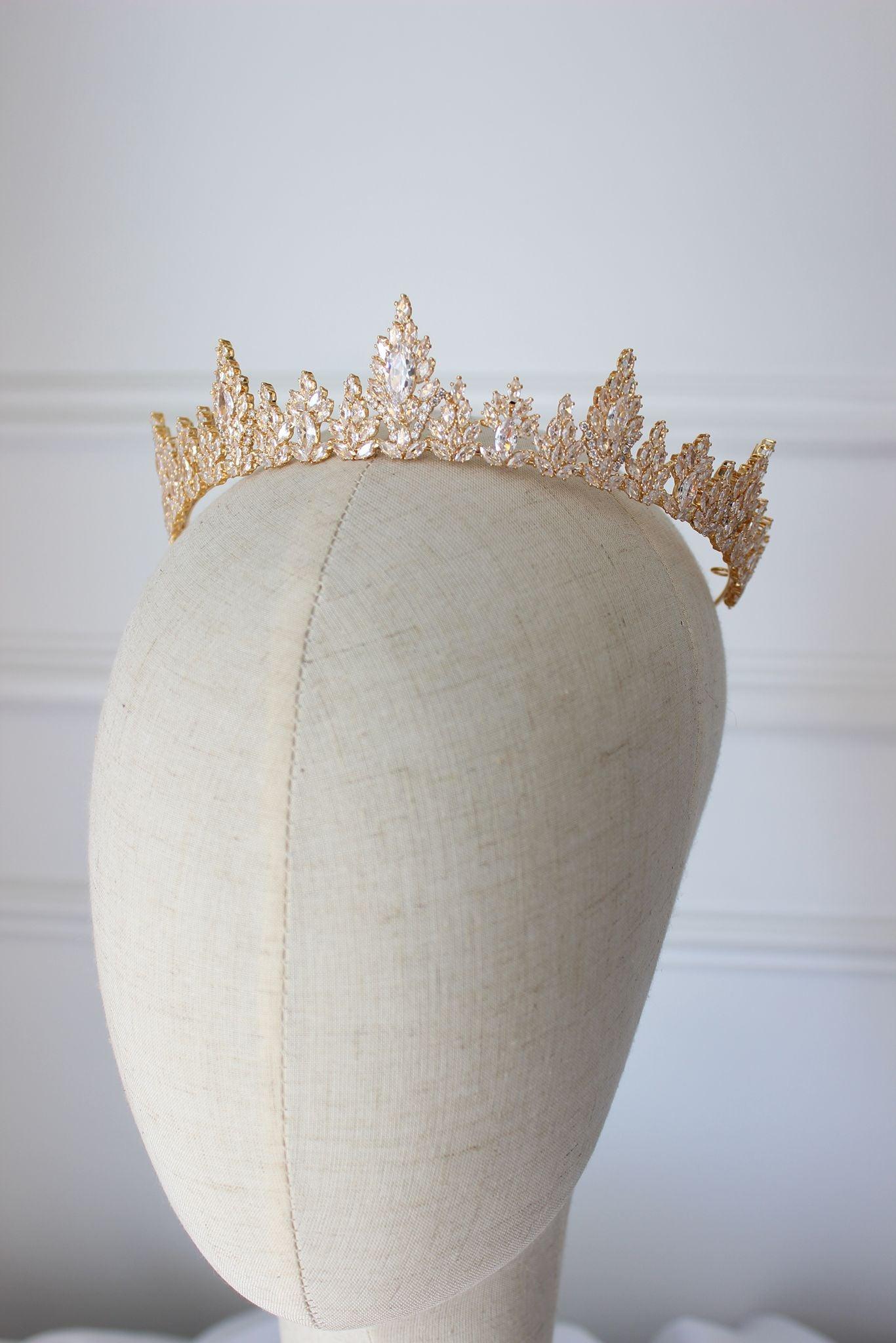 Medium gold wedding tiara with cubic zirconia crystals on mannequin