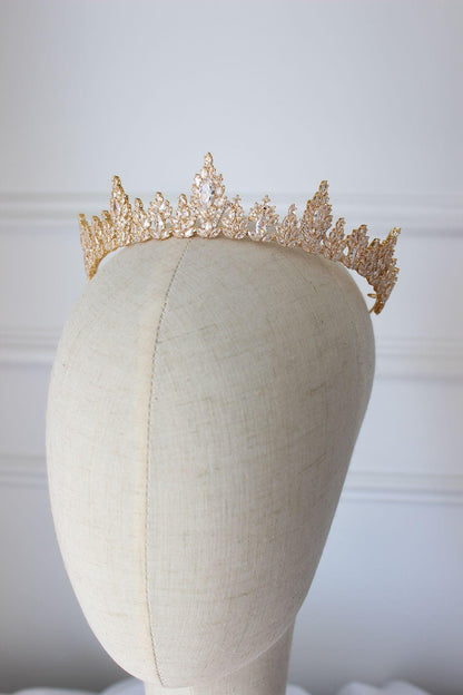 Medium gold wedding tiara with cubic zirconia crystals on mannequin